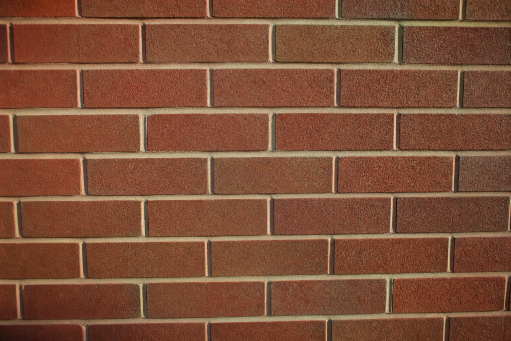 mur briques joints lisses et grains sable texture